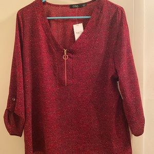 New with tags. Large, red blouse from Rue 21. Has 3/4 sleeve and never worn